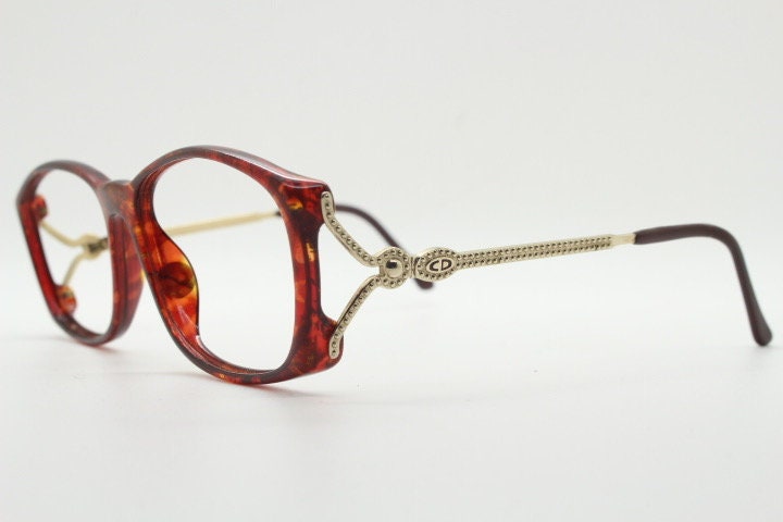 Christian Dior 80s vintage rectangular eye glasses made in Germany from Optyl. Striking marbled amber acetate optical frame. Prescription RX