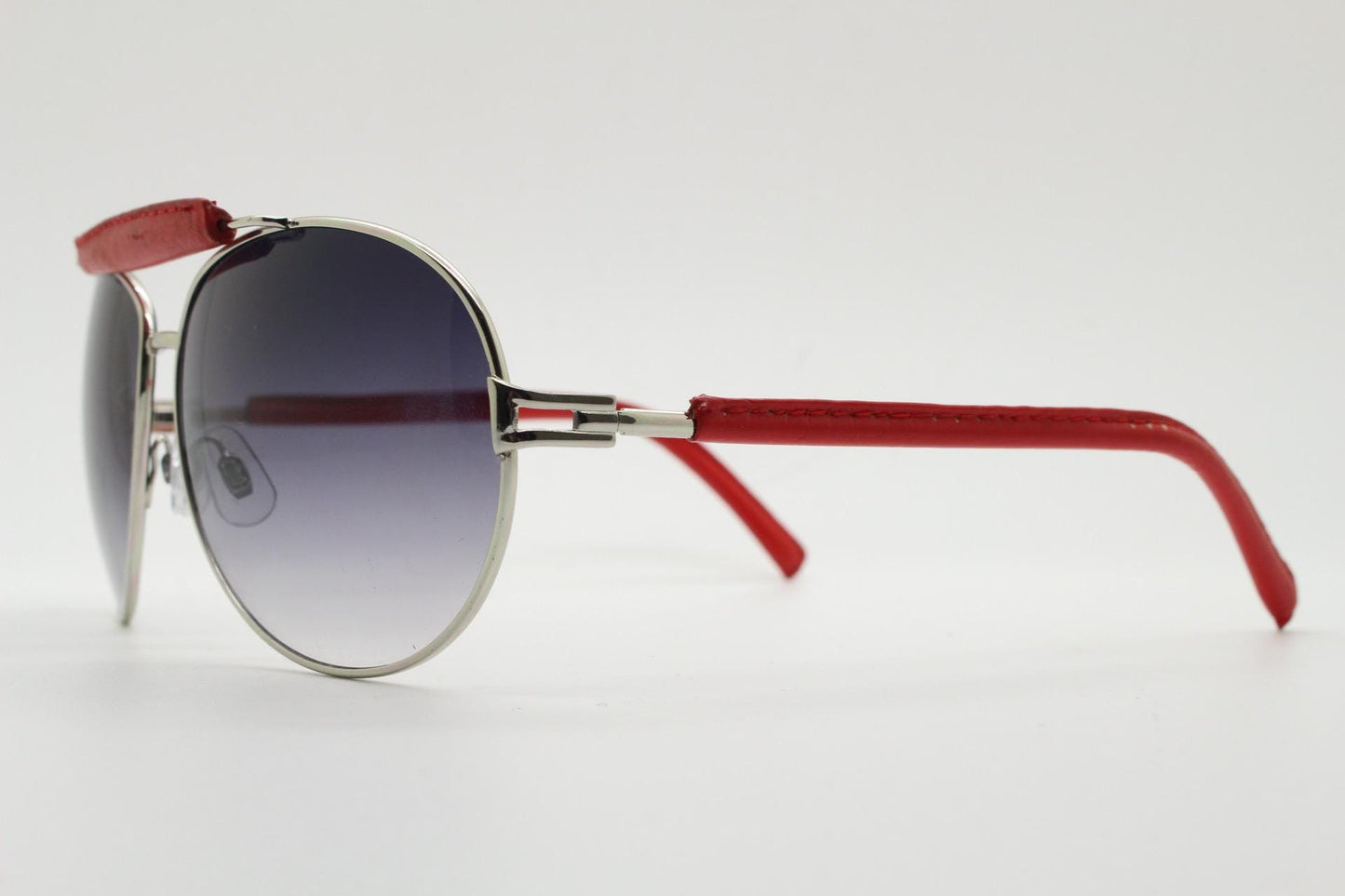Y2K vintage aviator sunglasses. 2000's silver metal frame with exaggerated bridge in red trim. 70s racing design. 00's NOS aviators