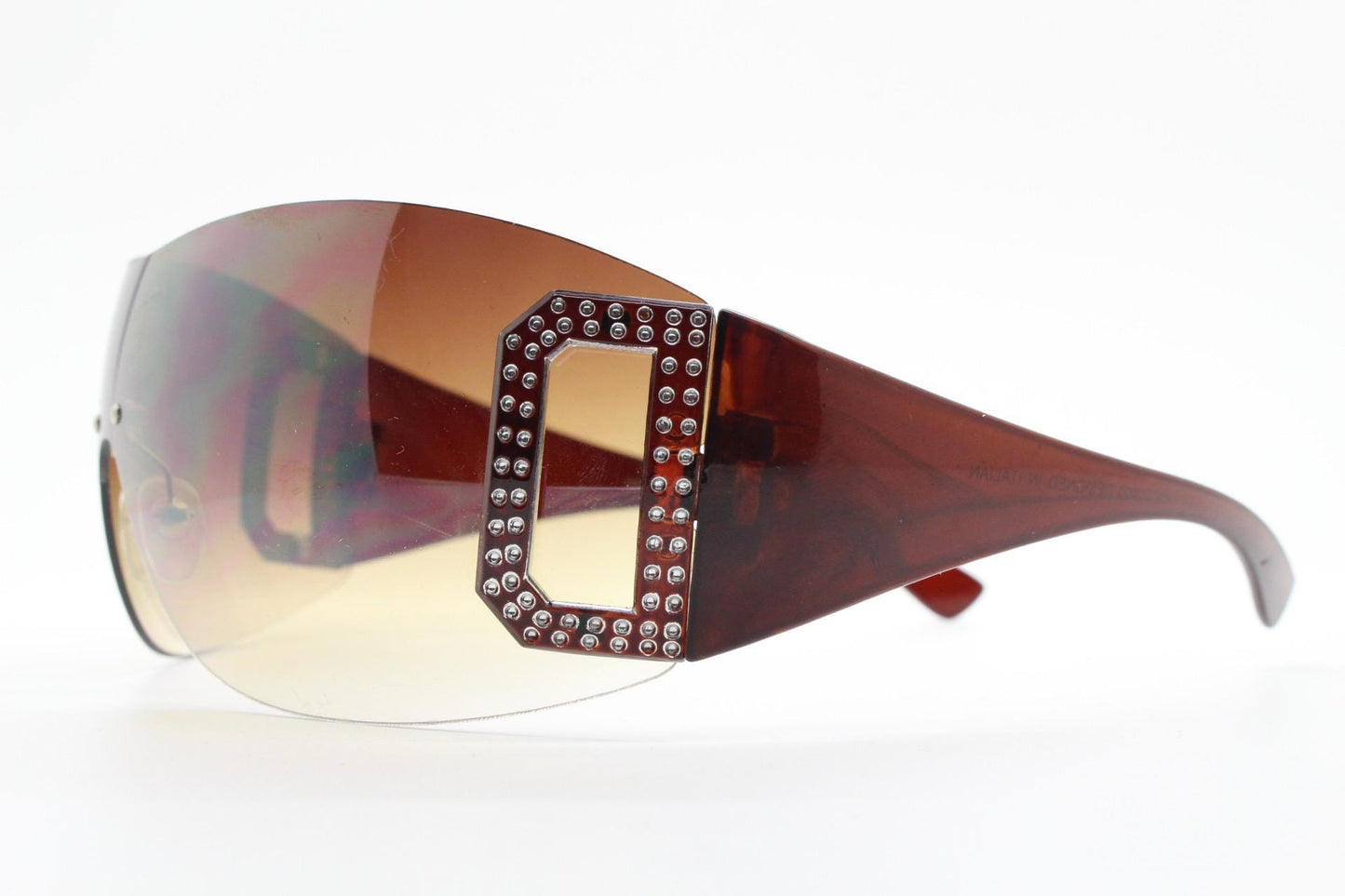 Y2K vintage visor sunglasses. 2000's brown wraparound mono lens shield design with big diamante effect crest. 00s uber fashion mini mask NOS