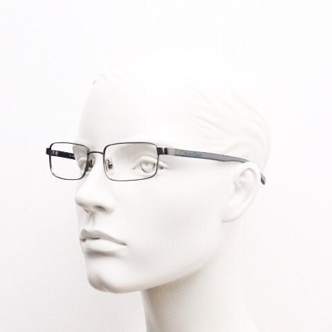 Calvin Klein collection rectangular eye glasses model 582 made in Japan. Gunmetal grey wire optical frames. Prescription eyeglasses. RX