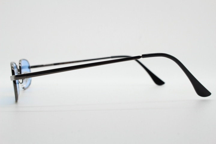 90s vintage small rectangular sunglasses. Imposing minimal gunmetal grey victorian style frame with sky blue lenses. Steampunk. Unused NOS
