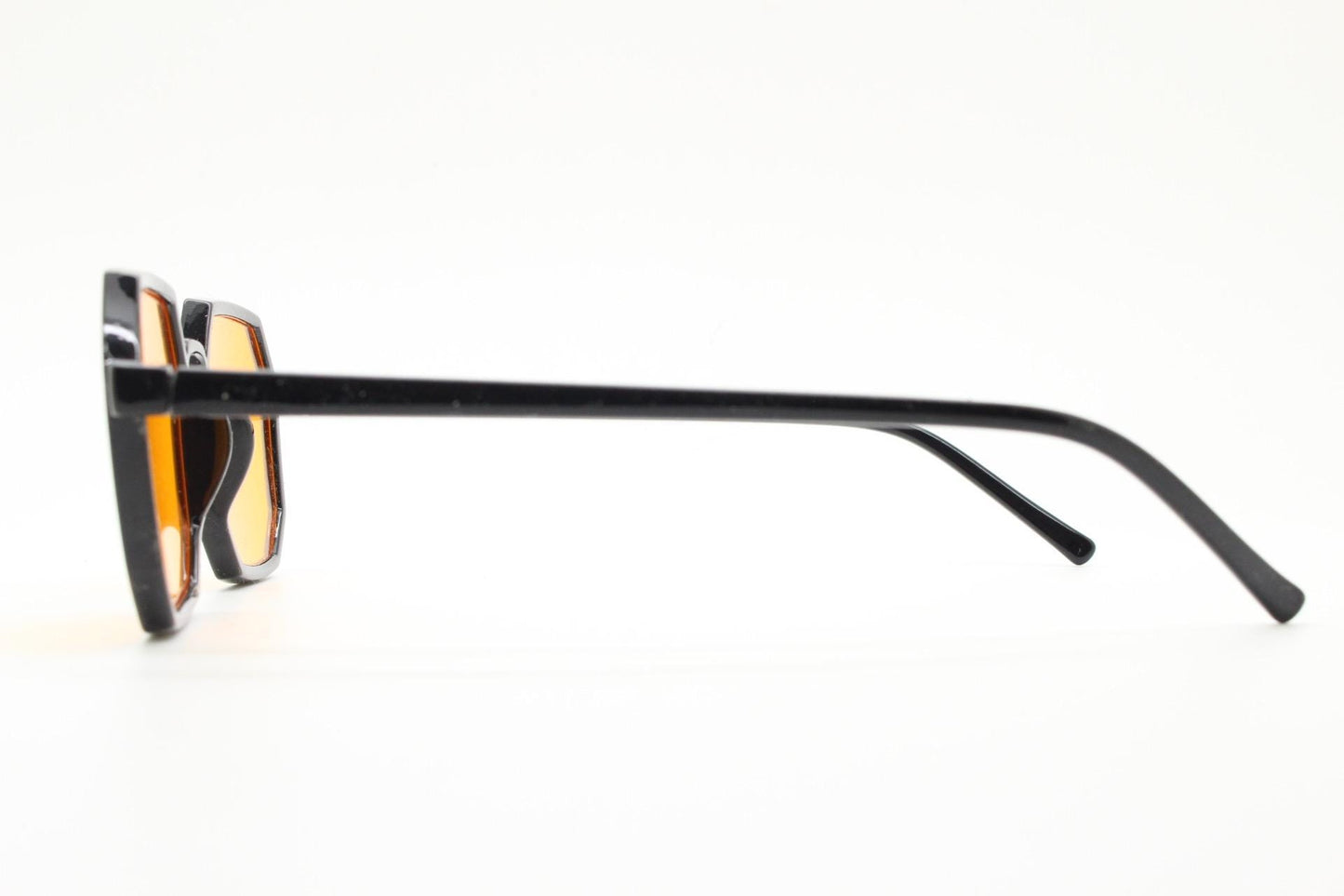 Vintage octagon sunglasses. Well proportioned subtle 8 sided black gloss frame with intense orange lenses. Rave. BNWT. NOS