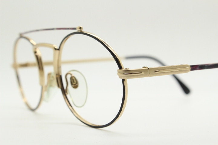 90s vintage oval eye glasses. Gold metal optical frame with vibrant enamel pattern and prominent double bridge. Prescription spectacles. NOS