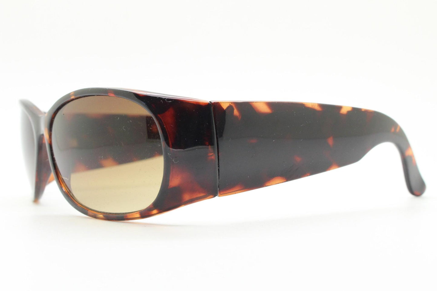 Y2k vintage wrap around bug eye sunglasses. Aerodynamic 60s design tortoise frame with full height arms in excellent proportions. 2000's NOS