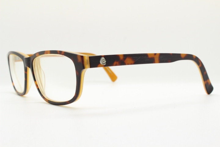 Cheap Monday rectangular low profile eye glasses. Brown and amber layered acetate optical frames. Prescription eyeglasses. RX spectacles