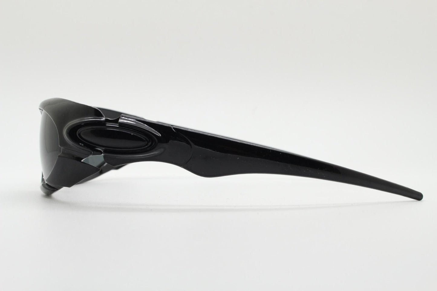 90s vintage sports shield sunglasses. All black gloss aerodynamic wraparound with many stylised features. 2000's. Hells angel uber fashion