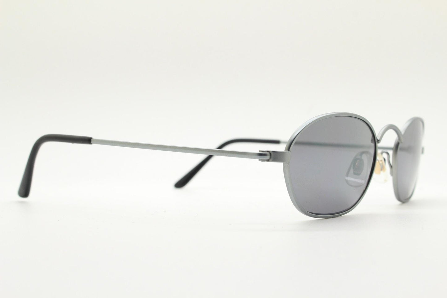 90s vintage small angular oval bug eye sunglasses. Minimal brushed satin finish frame with silver mirror lenses. Y2K. 2000s. Unworn NOS