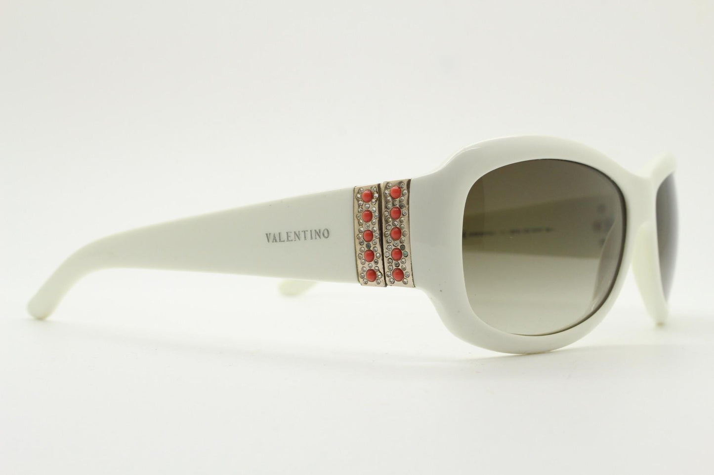 Valentino Y2k vintage wrap around bug eye sunglasses. Curving white acetate shield frame with orange and diamante stones. 2000s. Rhinestone