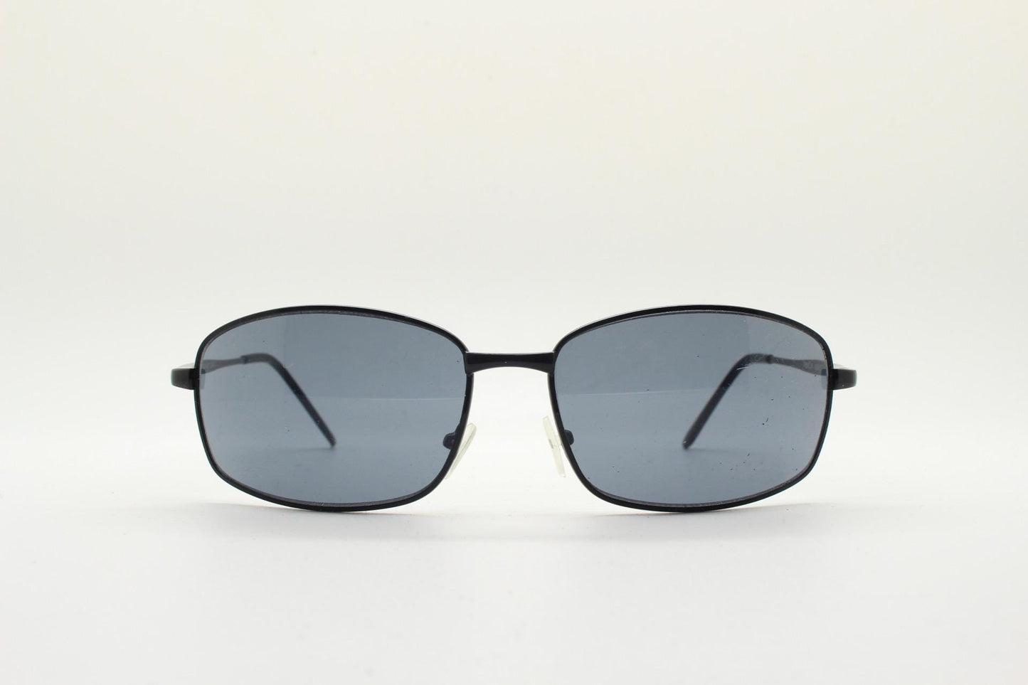 90s vintage wide rectangular sunglasses. Solid metal plain black gloss finish frame with curved lenses. 2000's. Y2K. NOS