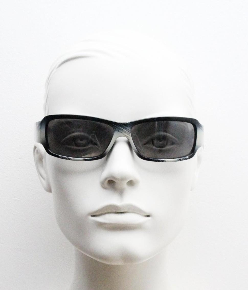 Y2k vintage wrap around rectangular sunglasses. Low profile curved white and black gloss frame with grey lenses. 2000's bug eye. NOS