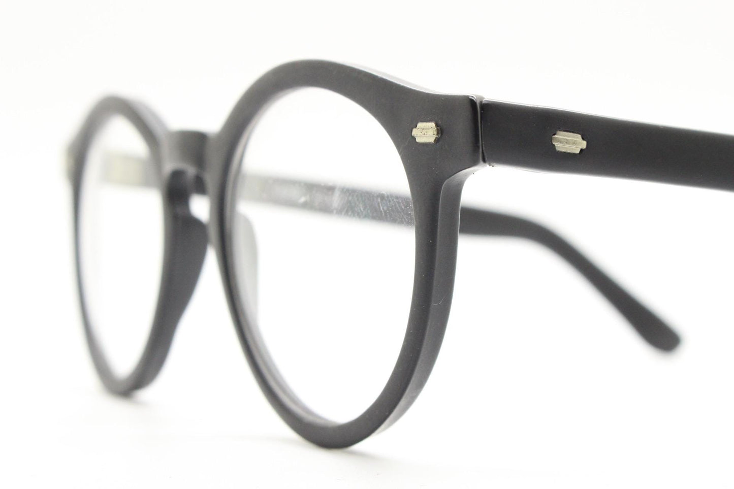 Oliver Smith round eye glasses. Black matt finish optical frames with protruding corners and keyhole bridge. Prescription RX eyeglasses
