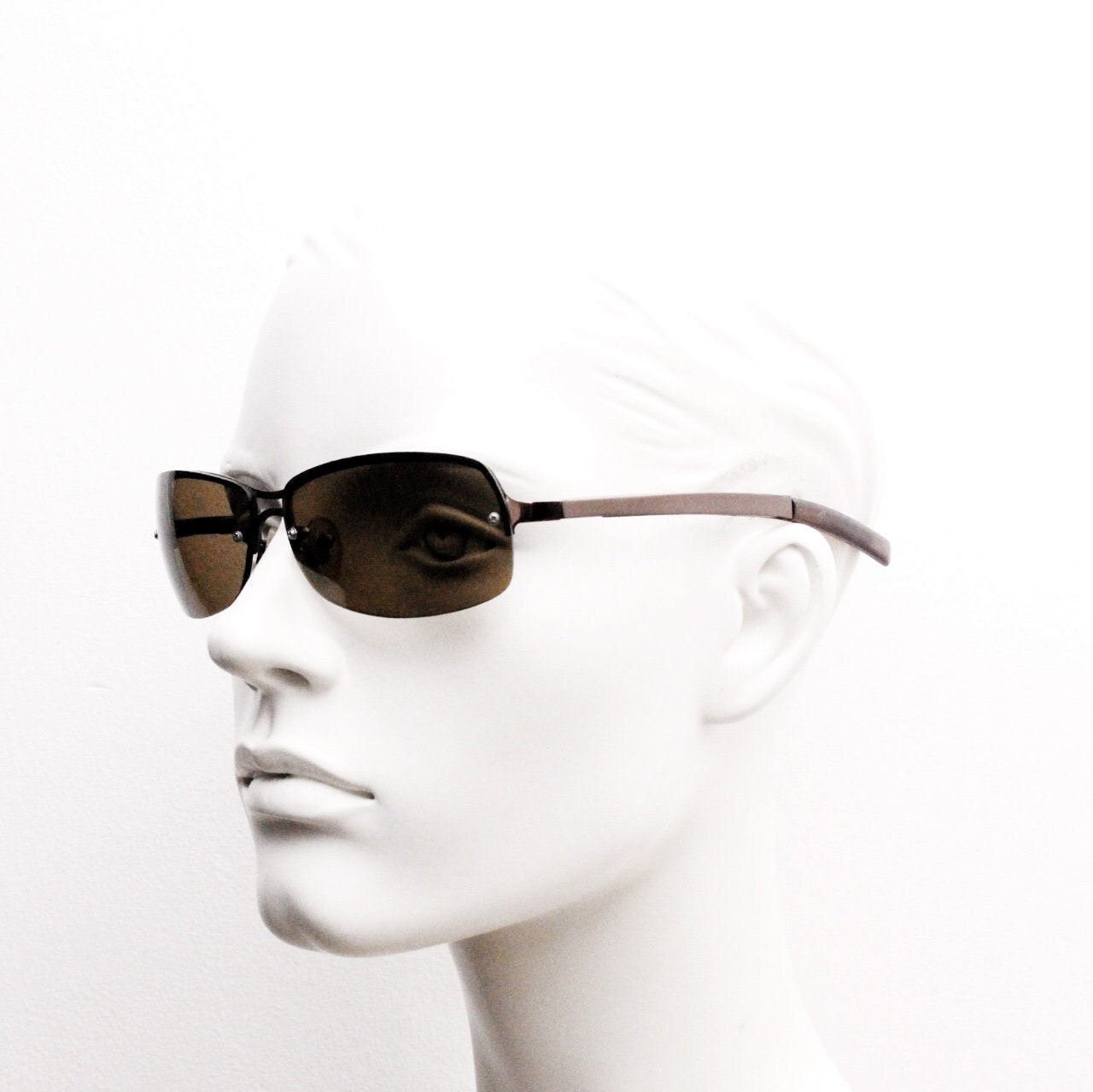 Y2K vintage modified small aviator sunglasses. Metallic brown chrome half frame with curved bug eye lenses and straight arms. 2000's. NOS