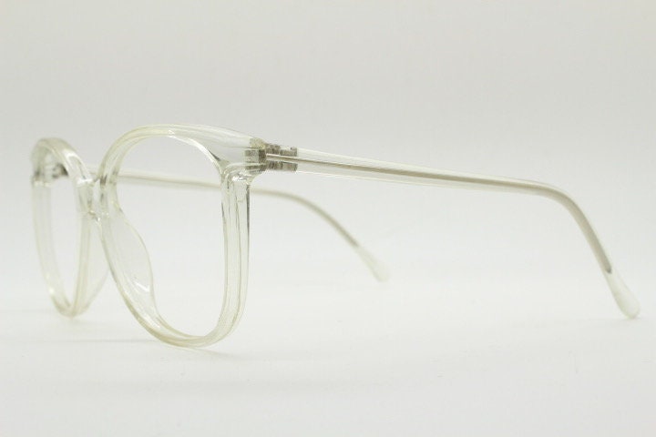 80s vintage oversized round cat eye glasses. Transparent clear crystal optical frame. Prescription RX spectacles. Clean NOS cateye