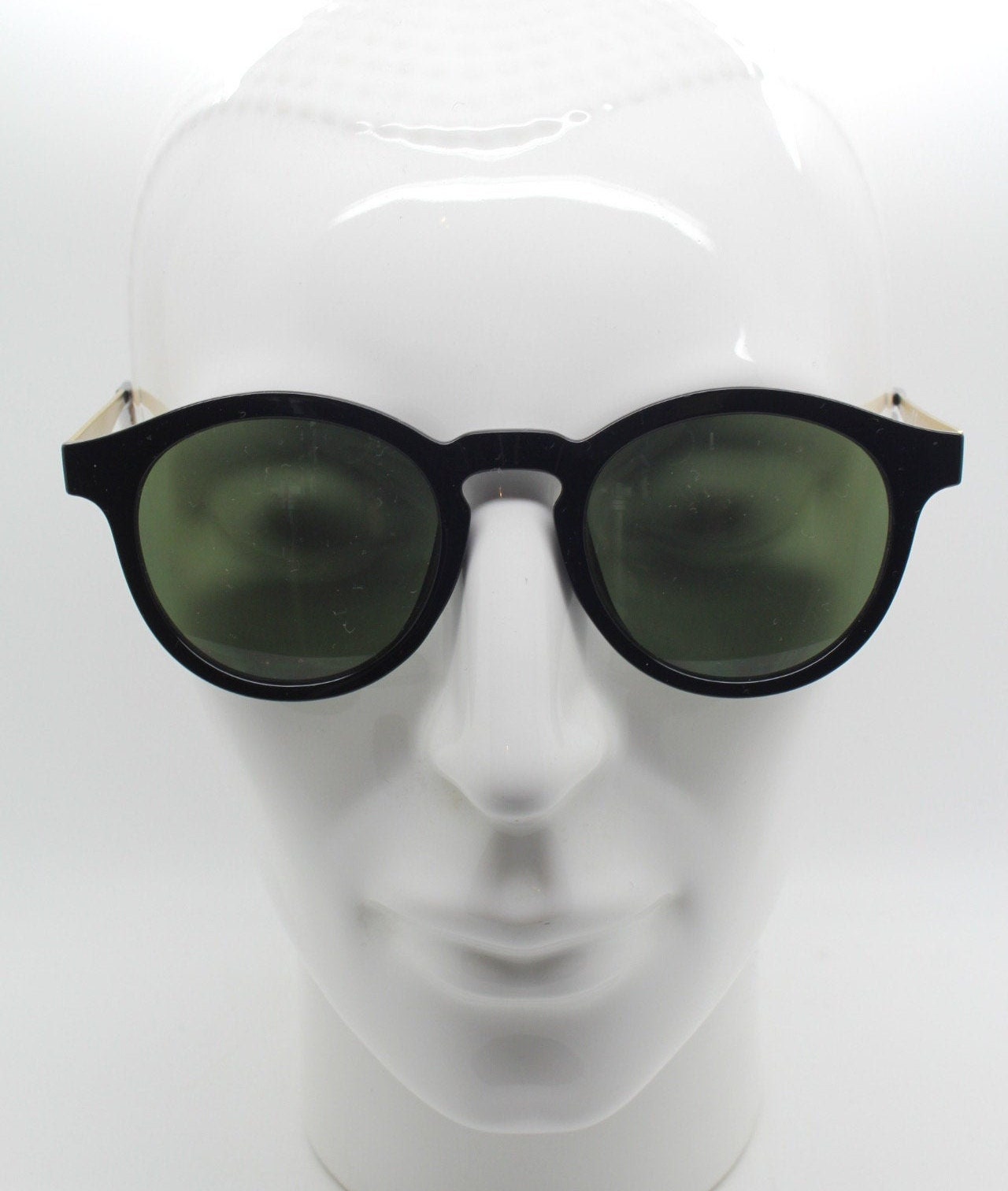 90s vintage round sunglasses. Black gloss frame with contrasting gold arms