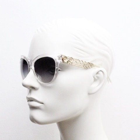 Dolce and Gabbana oversized cateye sunglasses model 4211. Womens transparent cat eye with cut-out florid metal arms and smoky lenses. NOS