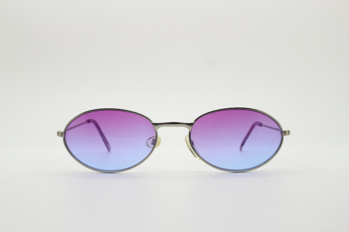 90s vintage small bug eye oval sunglasses. Silver satin frame with impressive pink to blue ombre graduating lenses. Y2K. 2000s. Unworn NOS
