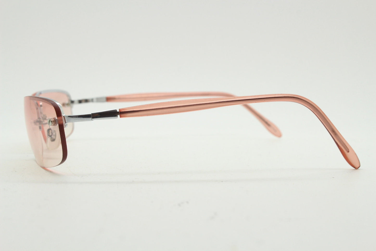 Y2K vintage wrap around rectangular sunglasses. Half frame in sharp chrome with extra light tone pink lenses. Rave 2000's. 00's NOS
