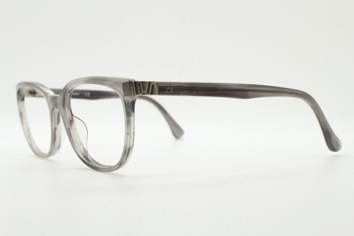 Calvin Klein rectangular eye glasses. Unisex transparent grey gloss acetate optical frames. Prescription eyeglasses. RX spectacles