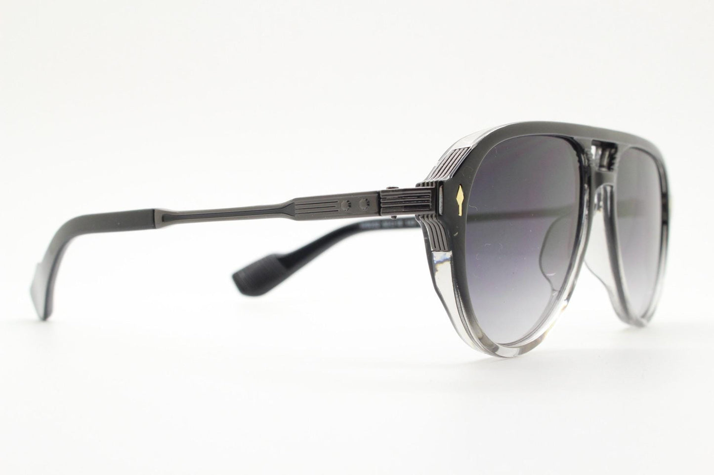 Y2K vintage transparent black aviator sunglasses. Well proportioned teardrop shape with graduating lenses and grey metal embossed arms. NOS