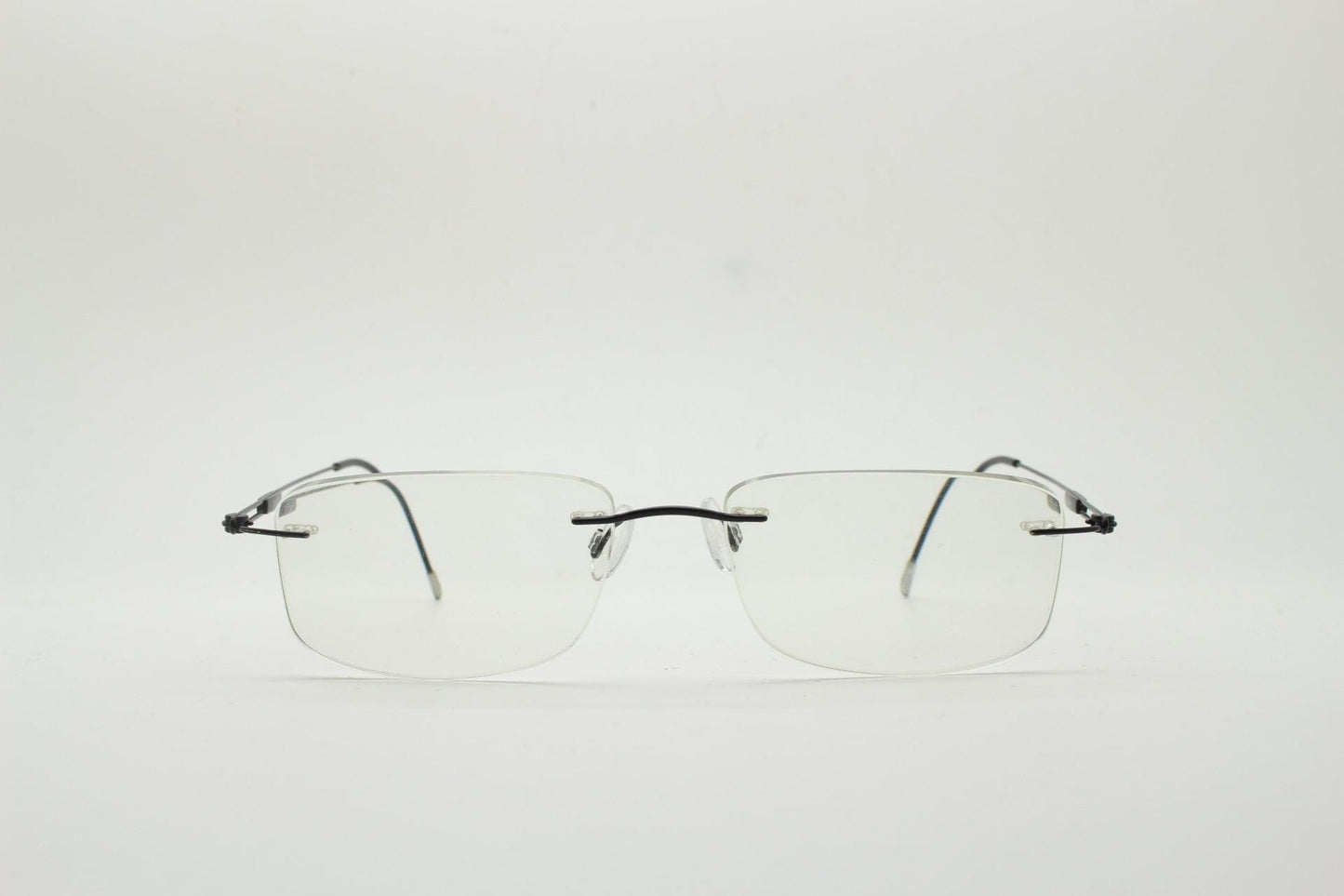 Silhouette rectangular frameless eye glasses made in Austria. Extremely minimal lightweight grey titanium optical frame. Prescription RX