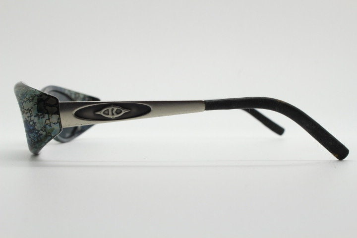 Killer Loop Shedevil 90s vintage shield sunglasses made in Italy. Low profile wrap around design with unique metallic print. One off sample