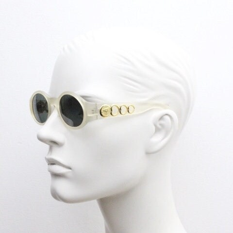 Vintage 90s oval transparent sunglasses. Frosted frame with dark green lenses and heart shaped chain link arms. Unworn NOS