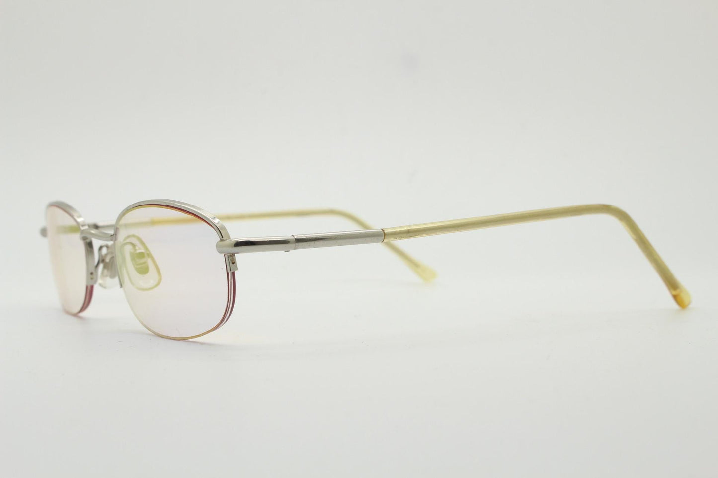 90s vintage small rectangular sunglasses. Silver chrome half frame with light tone lenses with gold mirror glaze. 2000's. Y2K. NOS micro