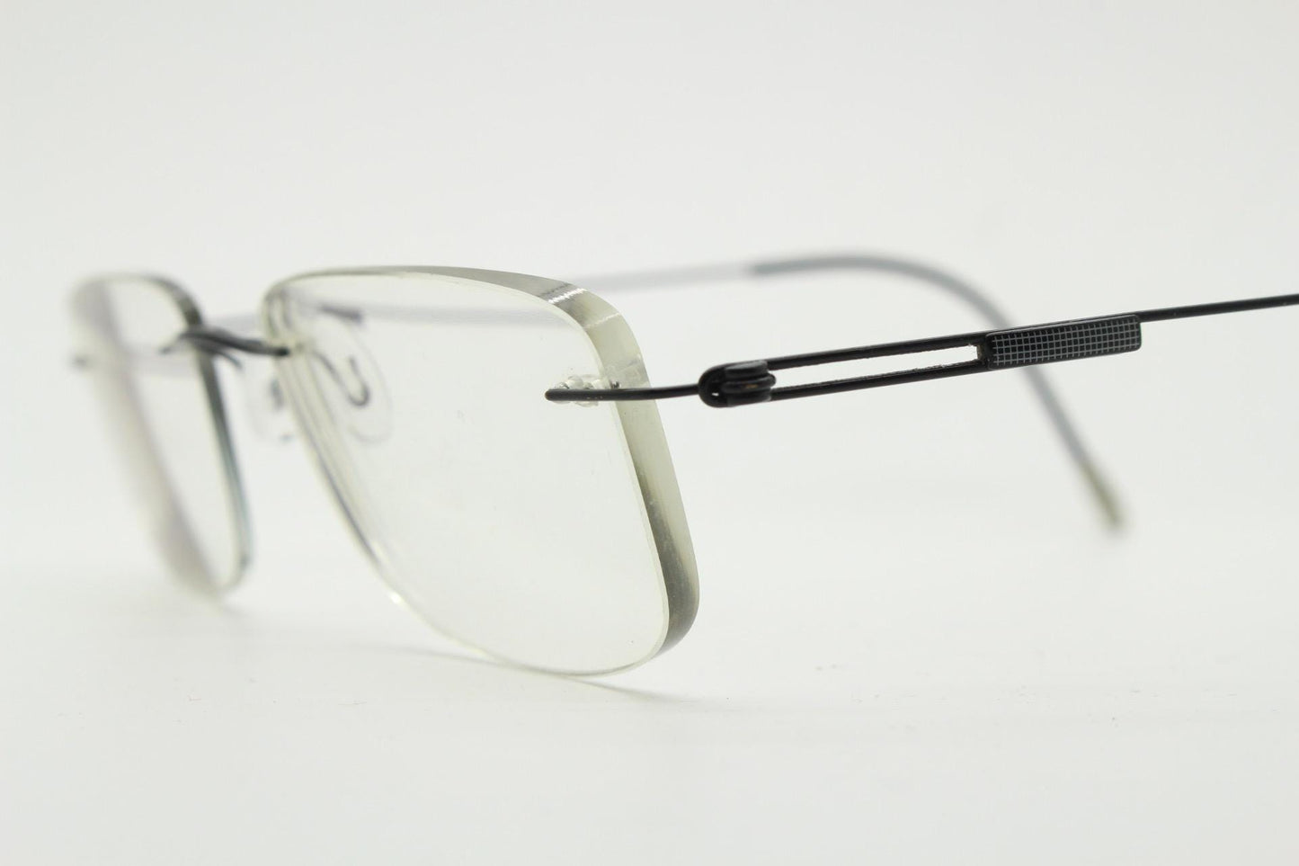 Silhouette rectangular frameless eye glasses made in Austria. Extremely minimal lightweight grey titanium optical frame. Prescription RX