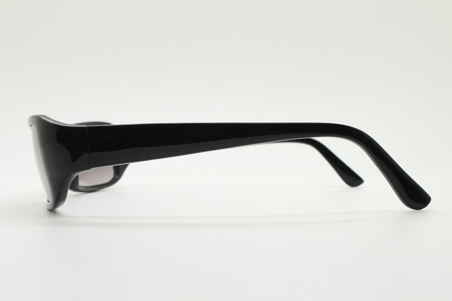 90s vintage rectangular curved wraparound sunglasses. Womens aerodynamic quality black acetate cat eye frame. Minimal shield design. NOS
