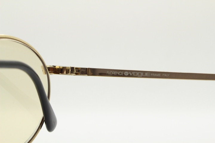 Vogue women's round eye glasses made in Italy. Gold chrome panto optical frame with indented diamond patterns. Prescription RX spectacles