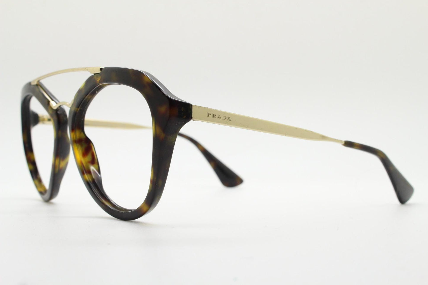 Prada angular eye glasses made in Italy. Thick tortoise acetate optical frames with prominent gold double bridge. Prescription. RX