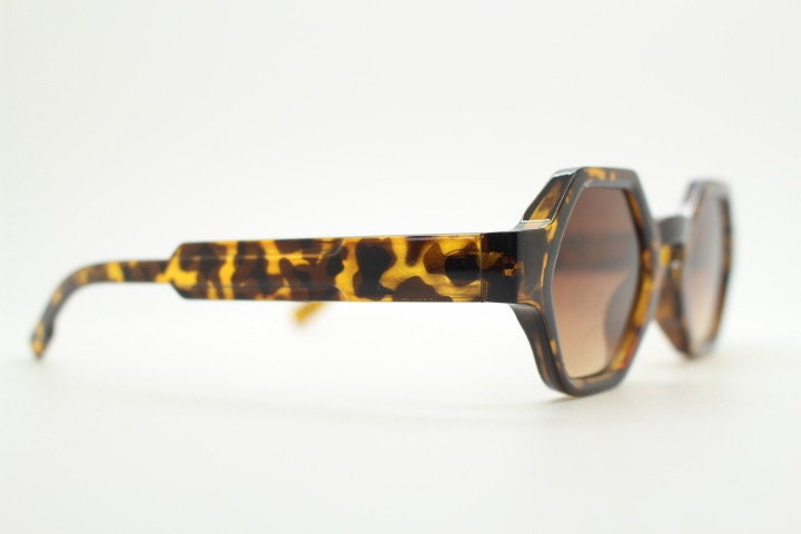 90s vintage hexagon sunglasses. 6 sided honey tortoise gloss chunky frame with graduating Havana brown lens tone. NOS