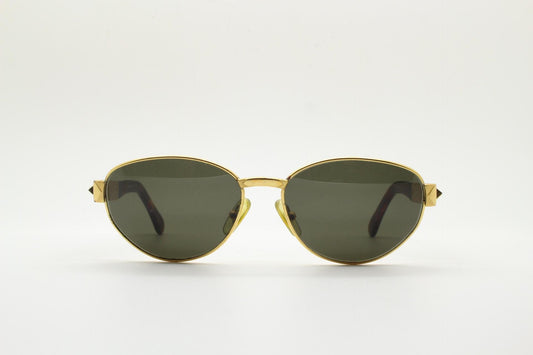 Gianfranco Ferre oval sunglasses made in Italy. Gold frame with triangular tortoise acetate arms and green lenses. 90s vintage GFF