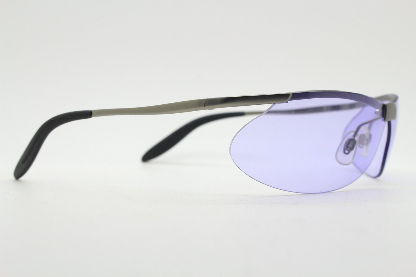 Y2K vintage sport shield sunglasses. 2000's half frame wraparound aerodynamic mini mask visor with purple bug eye lenses. 90s 00s unused NOS