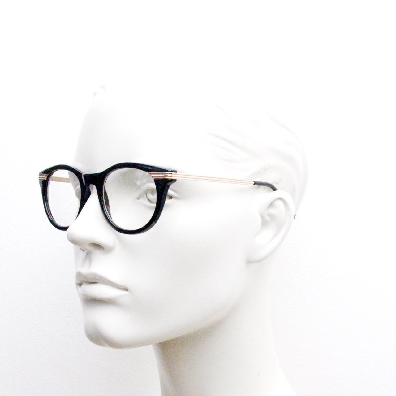 90s vintage cat eye glasses in black with gold metal arms. 50s, 60s style cateye prescription optical frames. Clear lens eyeglasses. RX