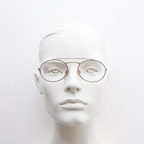 90s vintage oval eye glasses. Gold metal optical frame with vibrant enamel pattern and prominent double bridge. Prescription spectacles. NOS