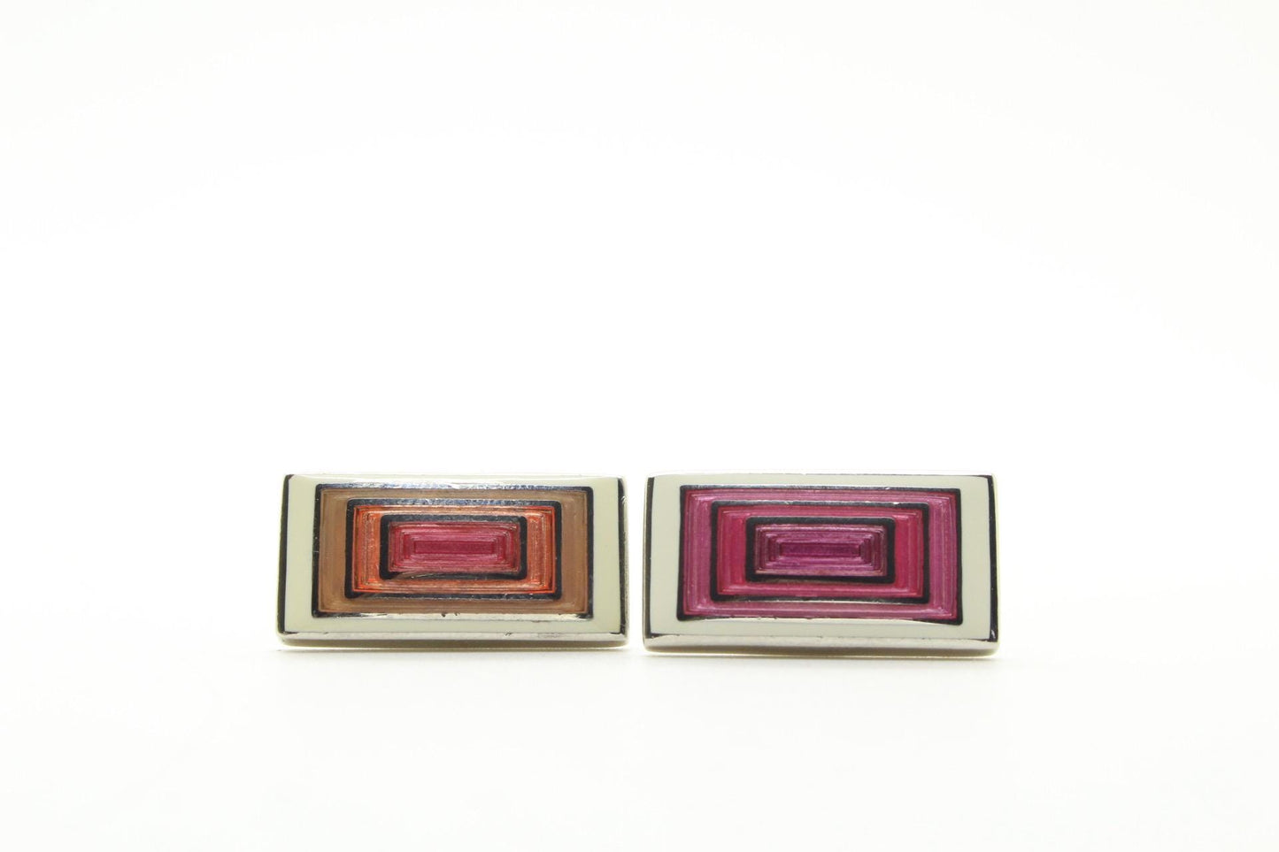 Vintage rectangular cuff links made in England by Herringbone. Solid metal construction with fine enamelled white, pink and peach tones. NOS