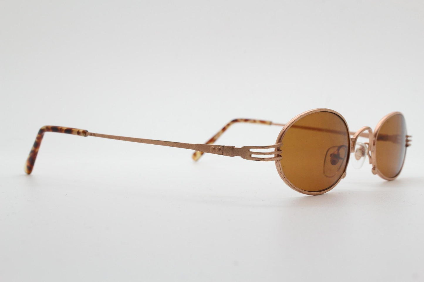 90s oval vintage metal sunglasses. Minimal small satin finish gold metal micro frame with brown lenses. Steampunk. Unused NOS