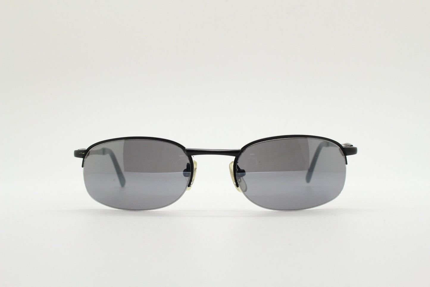 90s vintage small oval black sunglasses. Satin finish half frame with grey lenses and slight mirror glaze. 2000's. Y2K. Unused NOS