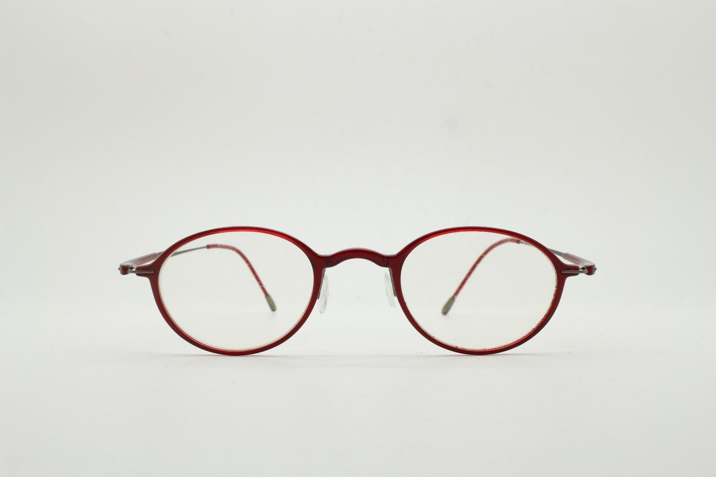 Silhouette rectangular frameless eye glasses made in Austria. Lightweight 1930s design with titanium. Red optical frame. Prescription RX