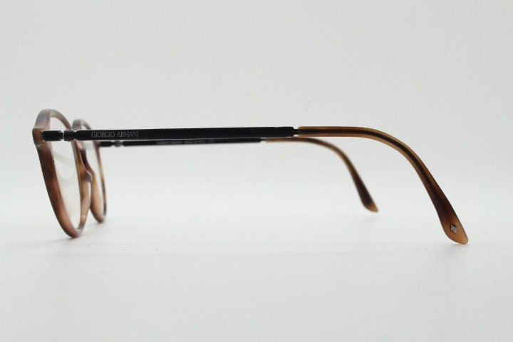 Giorgio Armani eye glasses model 7124 made in Italy. Mottled brown acetate optical frames with flat metal arms. Prescription eyeglasses. RX