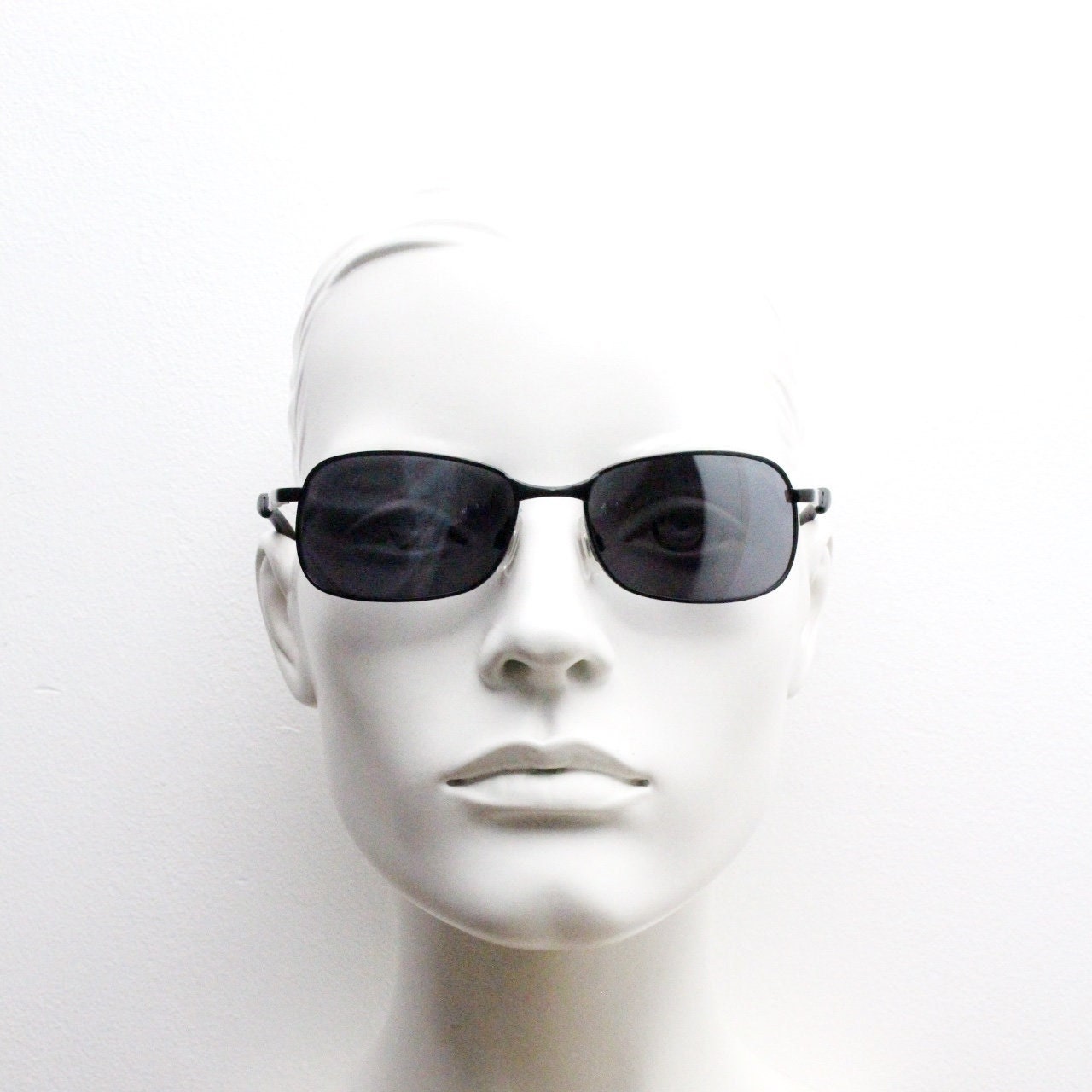 Y2K vintage wraparound sunglasses. Black satin matt finish on rectangular frame with slight mirror glaze lenses. 2000's. 90s. Unused NOS