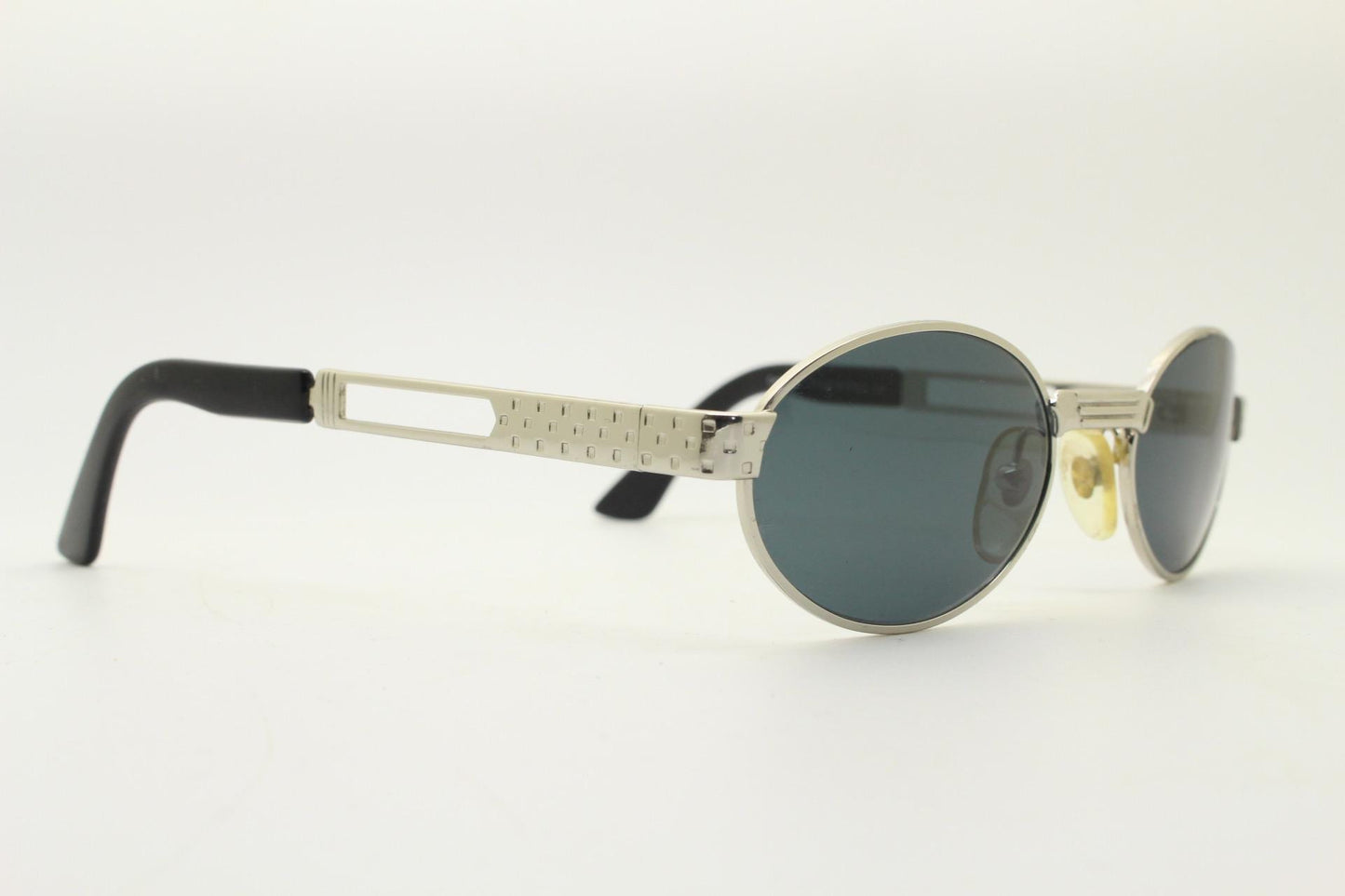 Prestige 90s vintage oval small bug eye sunglasses model 4028 made in Italy. Chrome finish solid metal frame with indented arm pattern. NOS