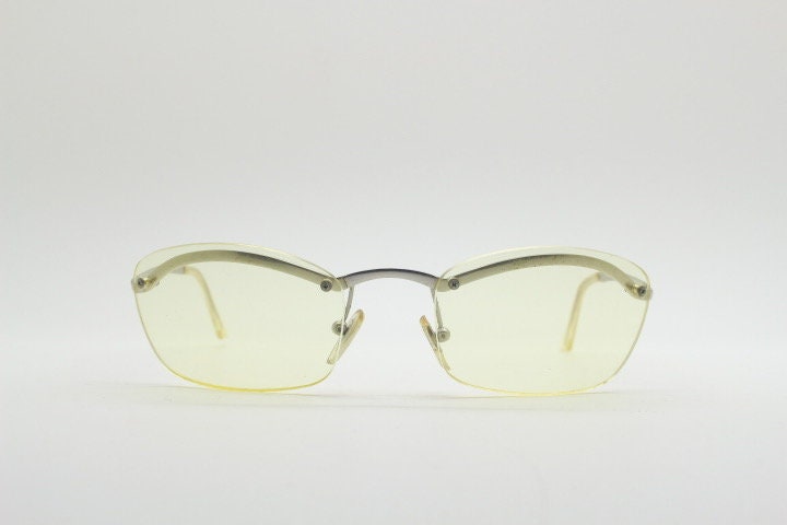 Y2K vintage half frame extra light tone yellow sunglasses with satin alloy brow line. Minimalistic 2000's wrap around design. 00's NOS