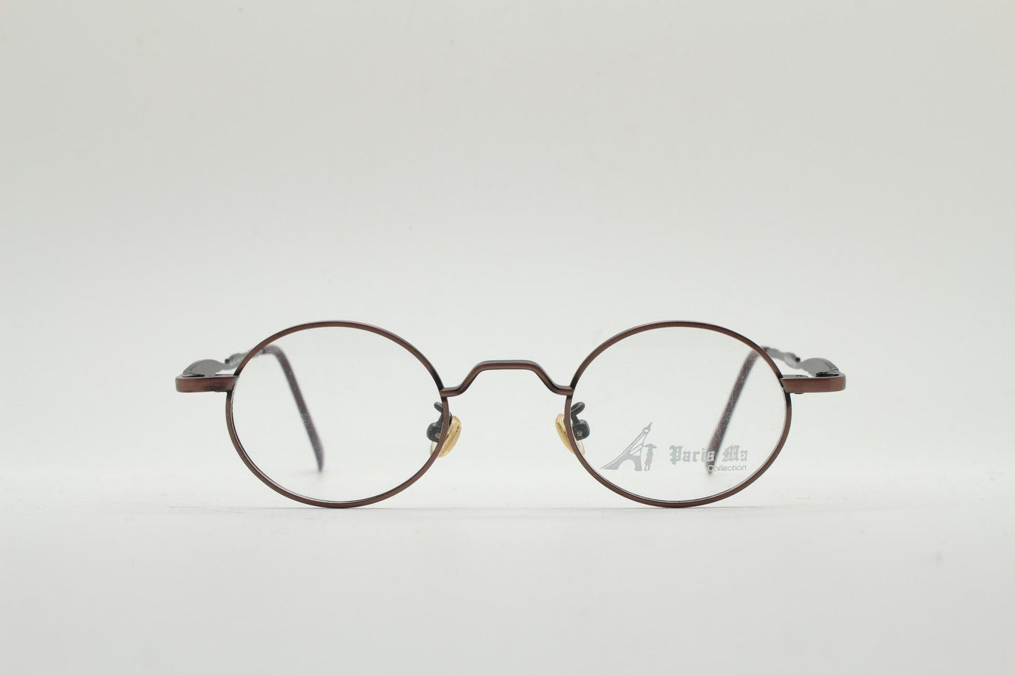 Paris Ma 90s vintage small oval eye glasses. Brushed bronze optical frames with scrolled arm details. Prescription. Steampunk spectacles NOS