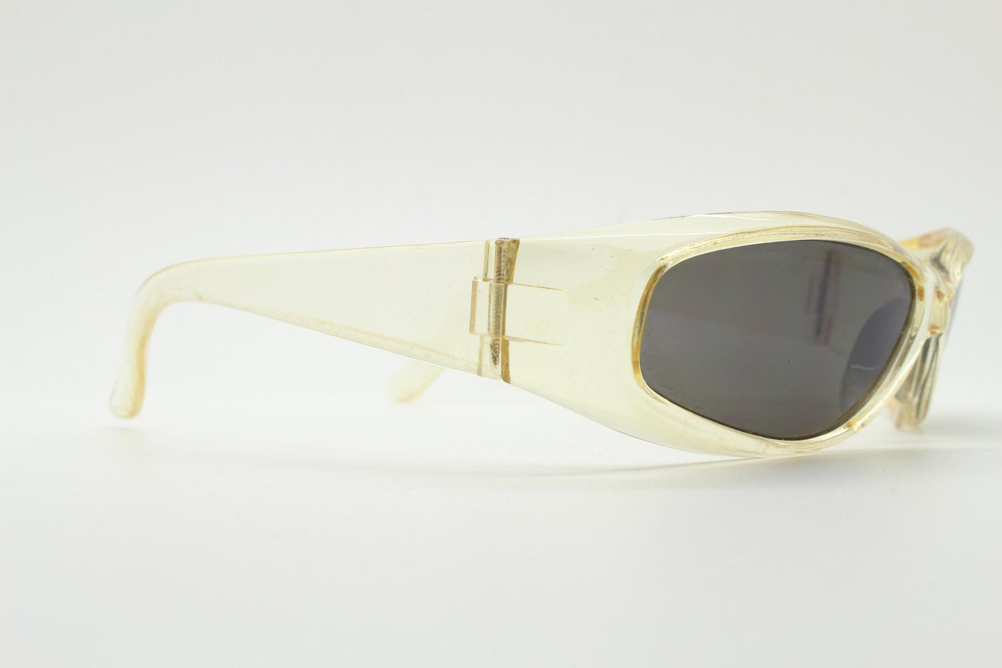 90s vintage sports shield sunglasses. Transparent yellow aerodynamic curved wraparound frame with contrasting black lenses. 2000's rave