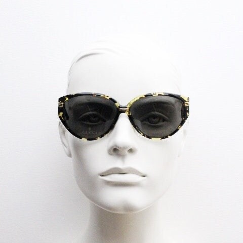 Gucci 90s vintage large oval sunglasses model 2135 made in Italy. Vibrant amber and mottled brown bug eye. NOS