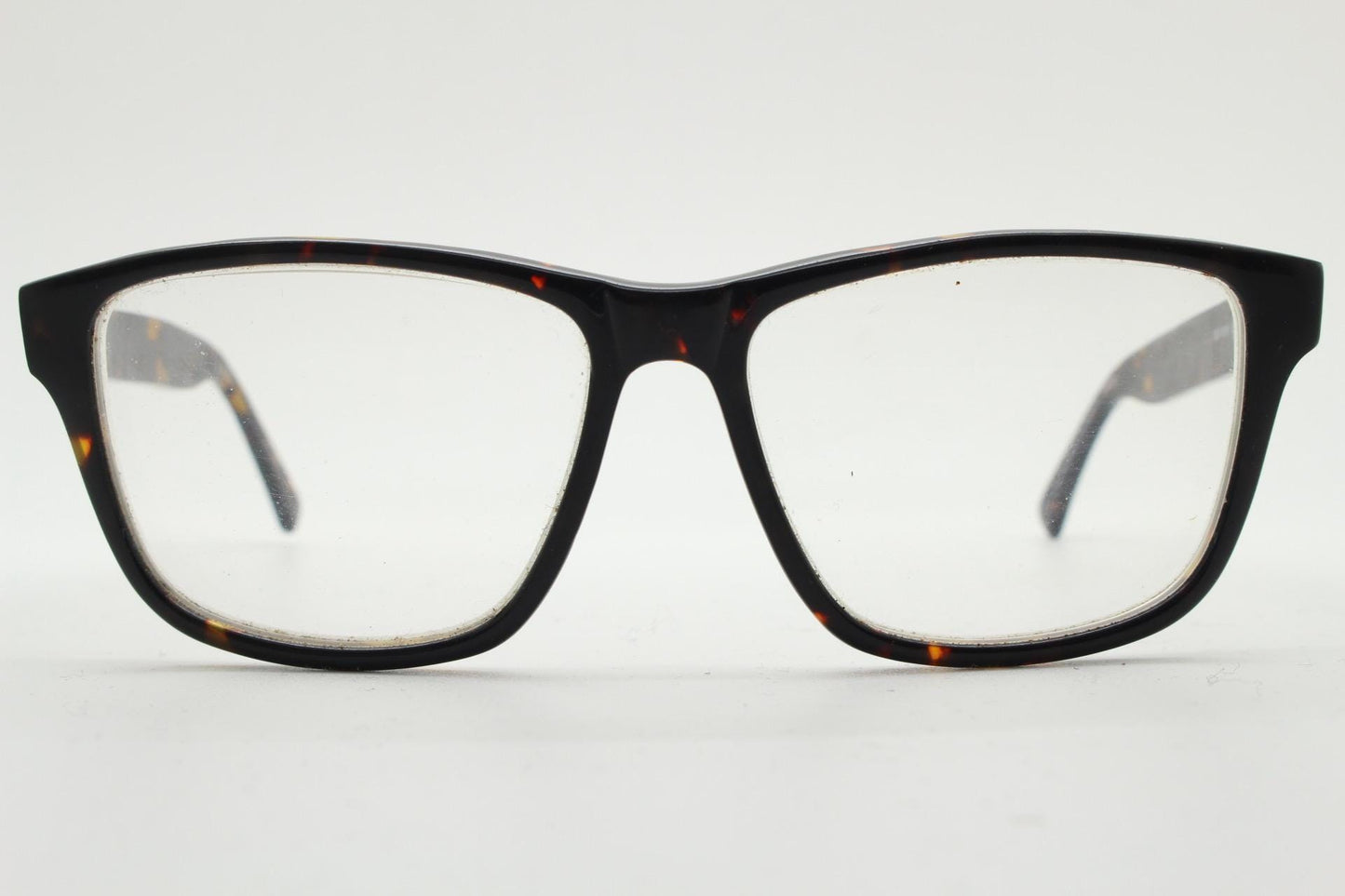 Cheap Monday rectangular low profile eye glasses. Dark brown tortoise gloss finish acetate optical frames. Prescription RX spectacles