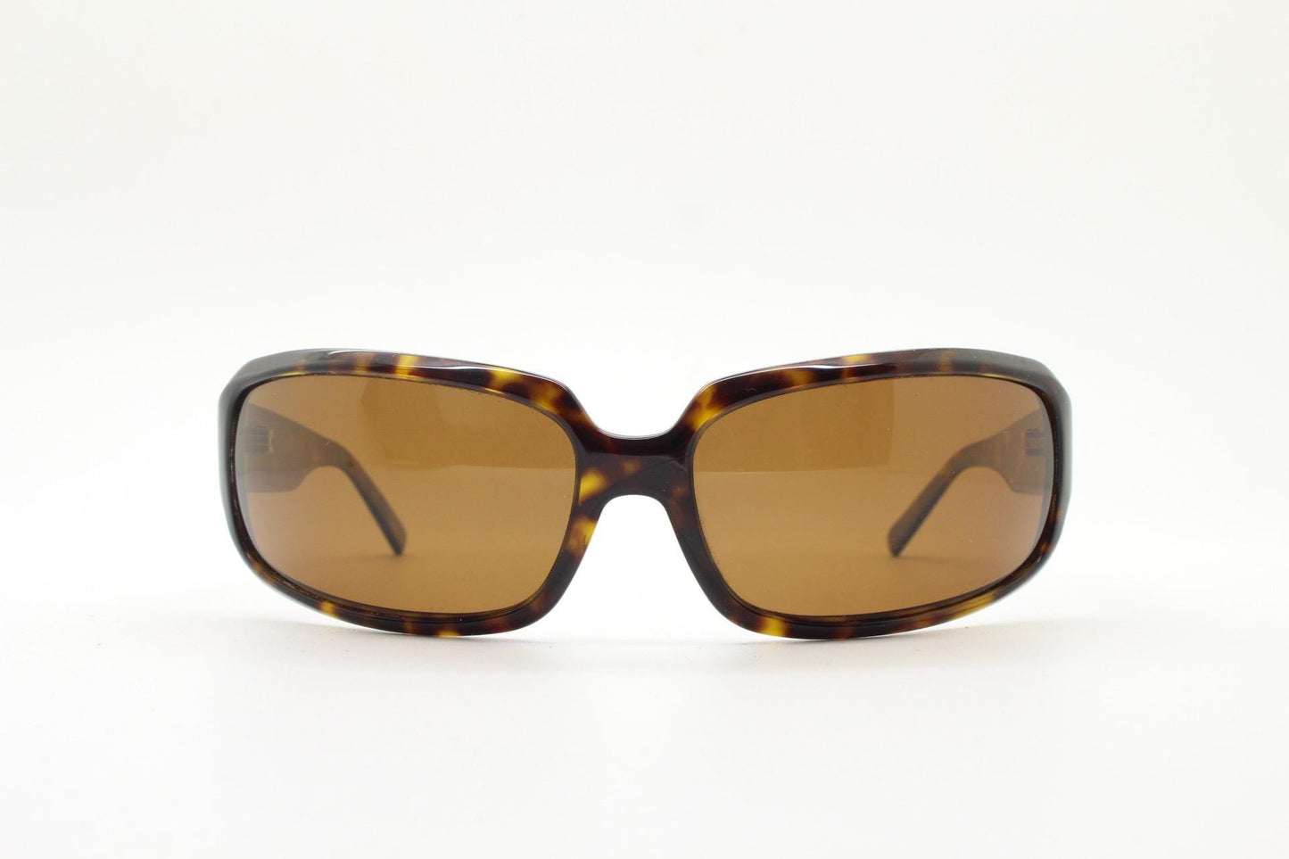 Oliver Peoples vintage Y2K wrap around sunglasses model Impala made in Japan. Curved bug eye in mottled brown tortoise acetate