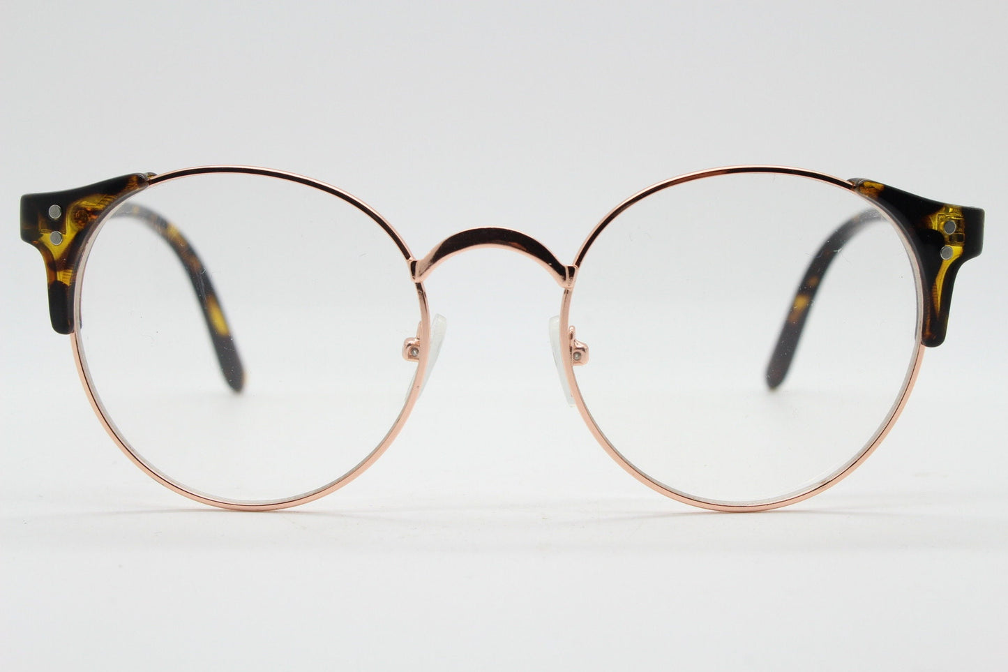 90s vintage modified cat eye glasses. Tortoise arms with a round gold face. 40s, 50s style clear lens eyeglasses. Cateye